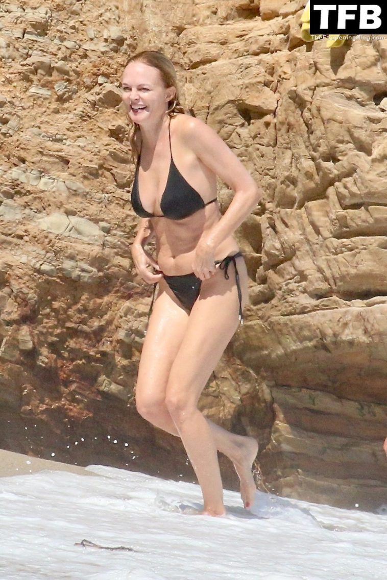 Heather Graham Slips Into a Black Bikini for a Beachside Frolic Next to a Mystery Man (35 Photos)