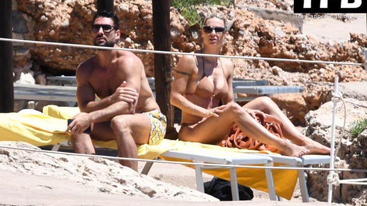 Michelle Hunziker & Giovanni Angiolini Relax on the Beach of Their Hotel in Sardinia (16 Photos)