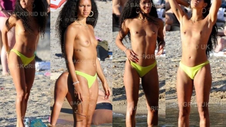 Vick Hope Displays Her Nude Breasts on the Beach in Ibiza (2 Photos)